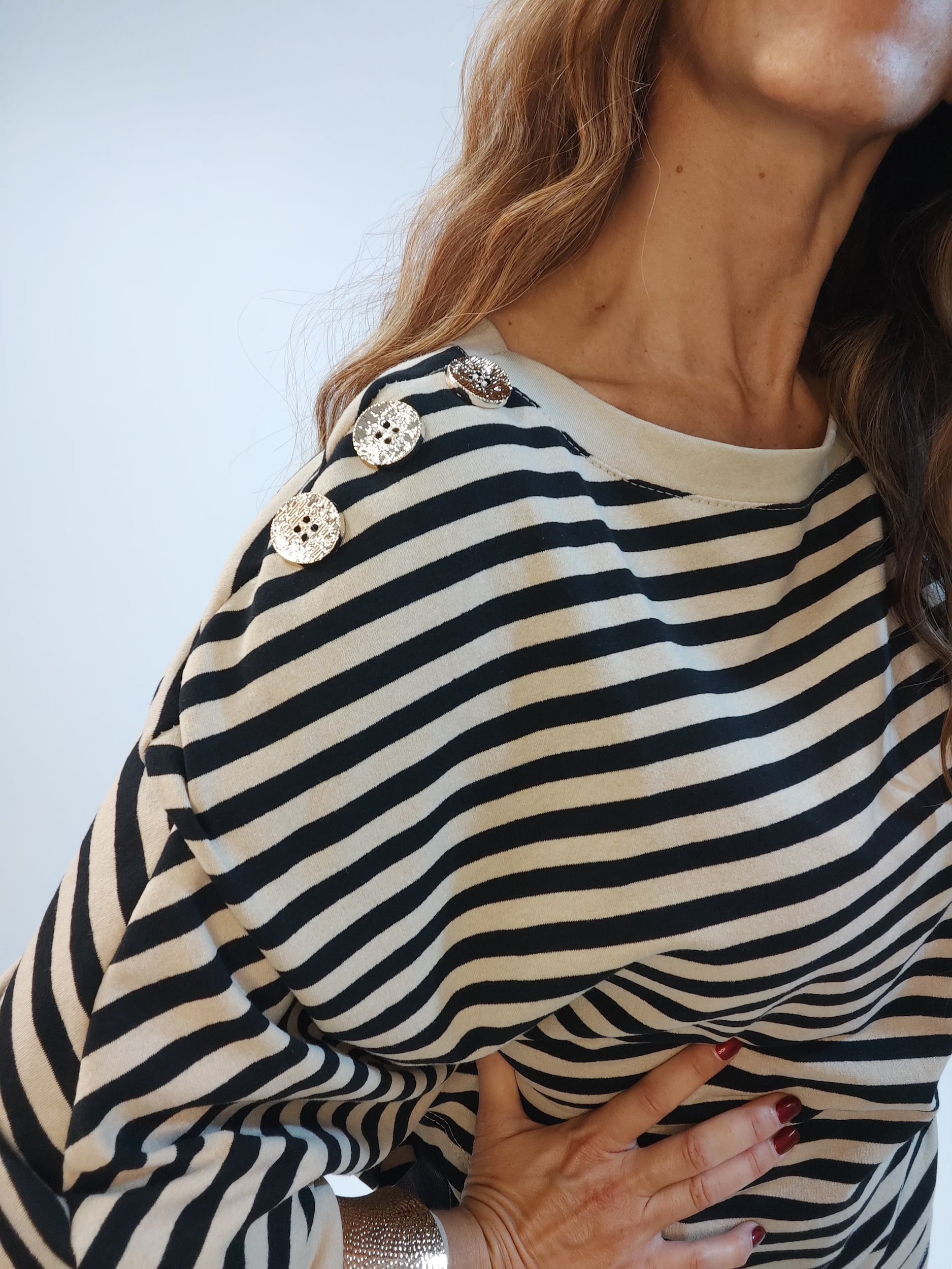 Maglia a righe con maniche a pipistrello