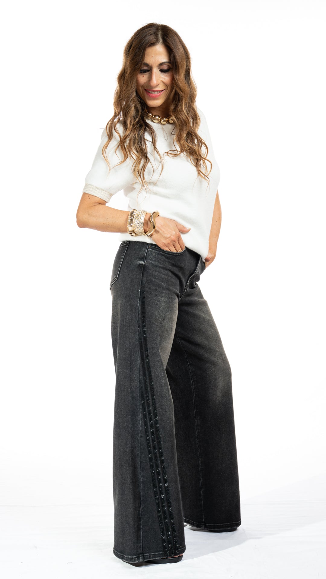 Jeans con banda laterale di brillantini tono su tono